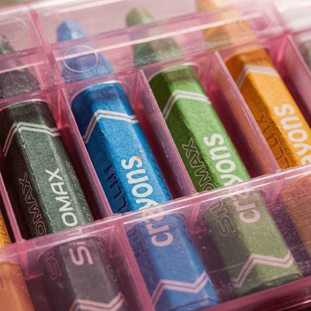 Set of Doms Wax Crayons arranged in a clear plastic case - 12pcs